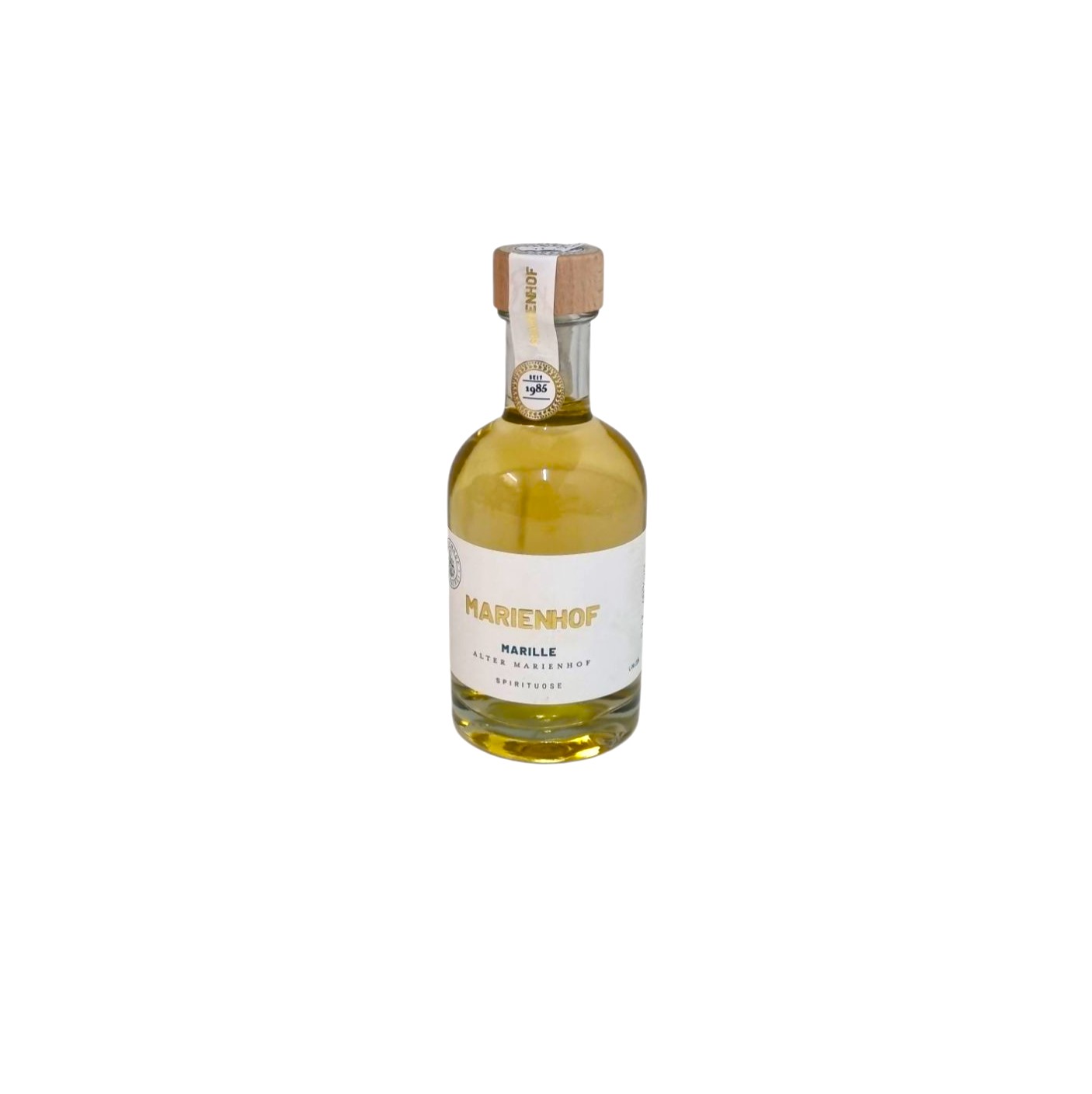 Runde helle Flasche gefüllt mit Marille Spirituose